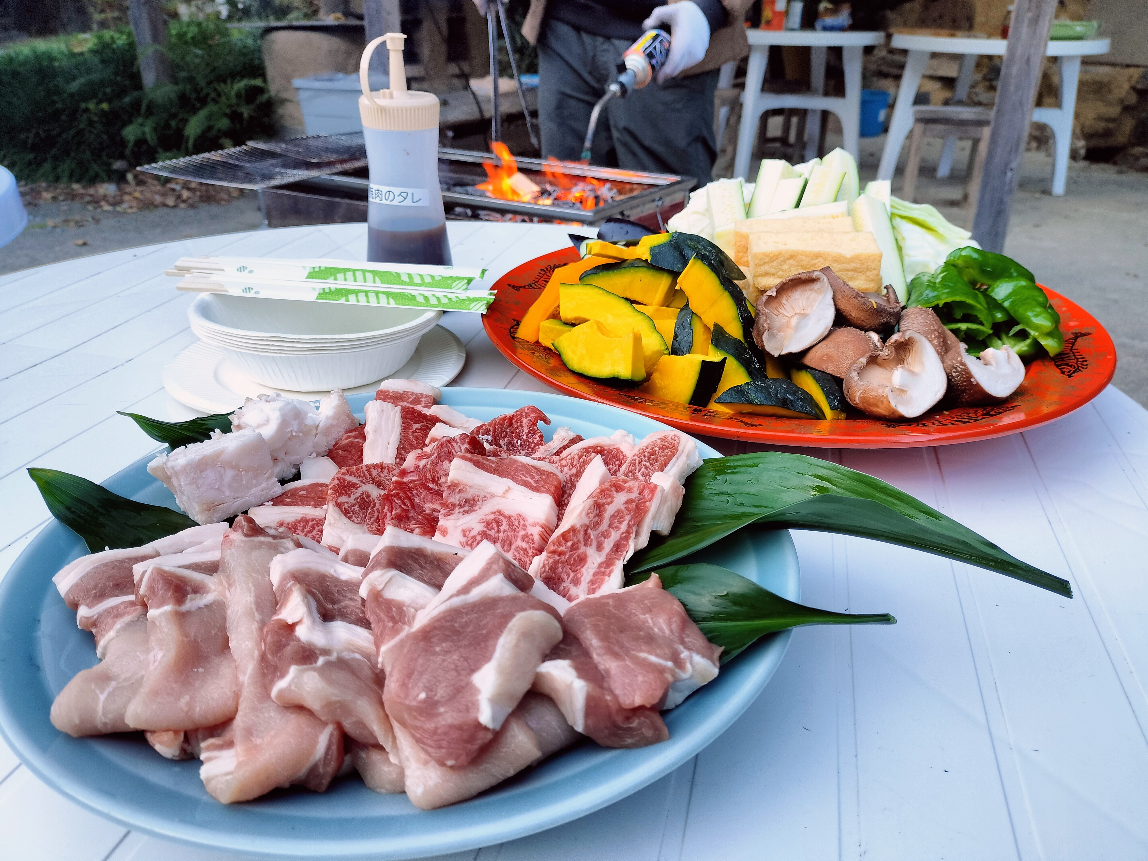 BBQ set with meat, vegetables, and grill at Shimonanosato