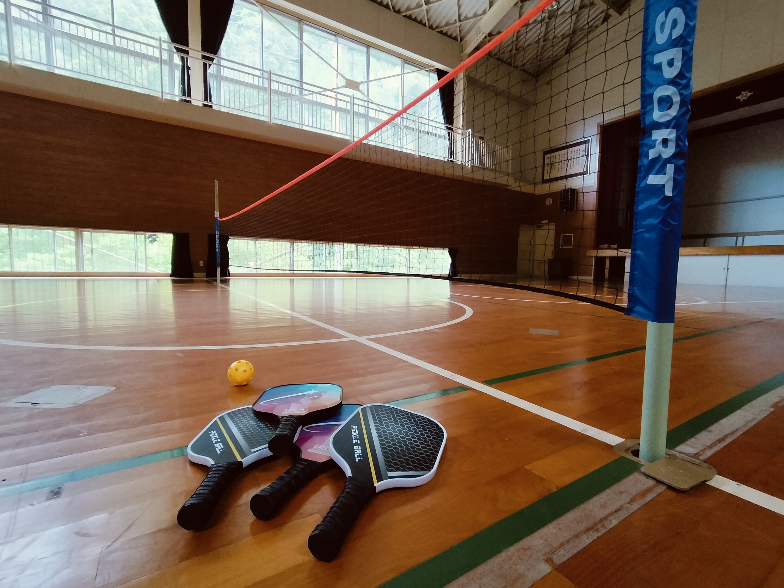School gym with pickleball equipment at Shimonanosato