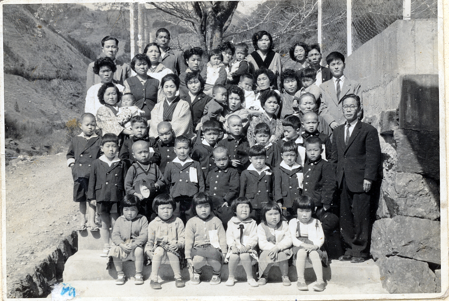 Historic black-and-white class photograph from Shimonanokawa Elementary School