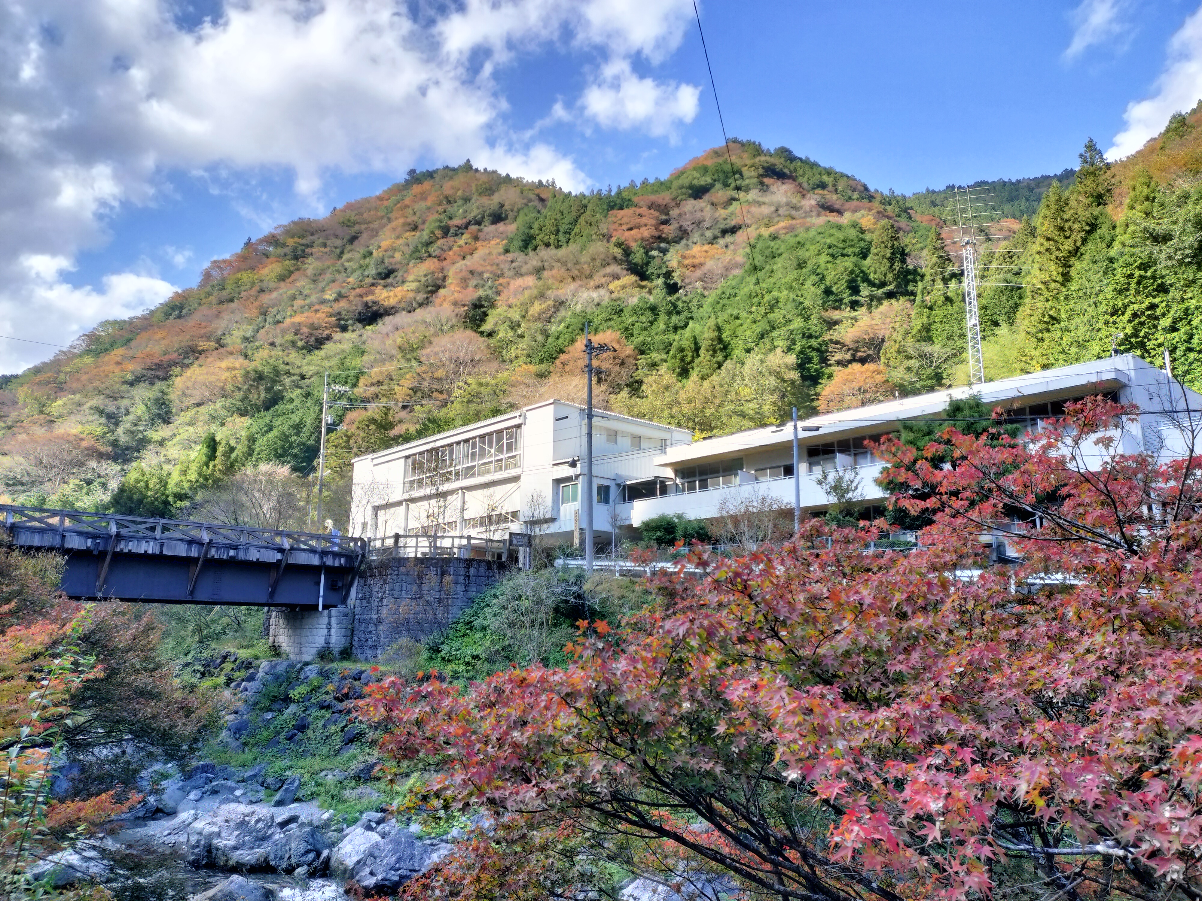 Shimonanosato, the former school beside the river and mountains in autumn