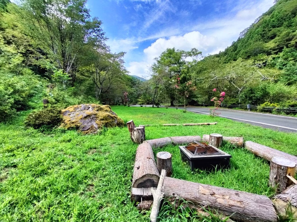 Shared community firepit at Yumenomori Campground