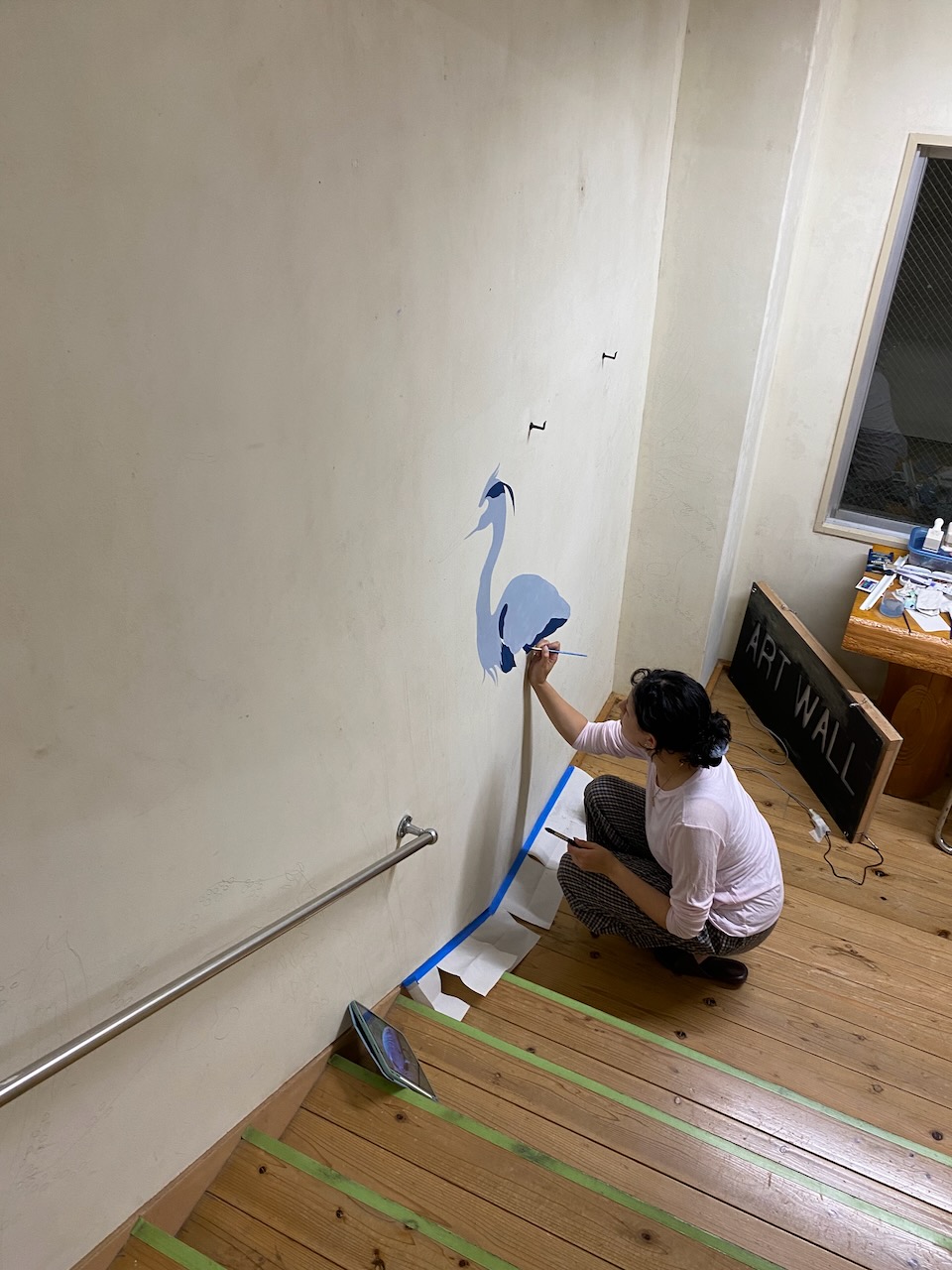The nature-inspired bug wall being painted