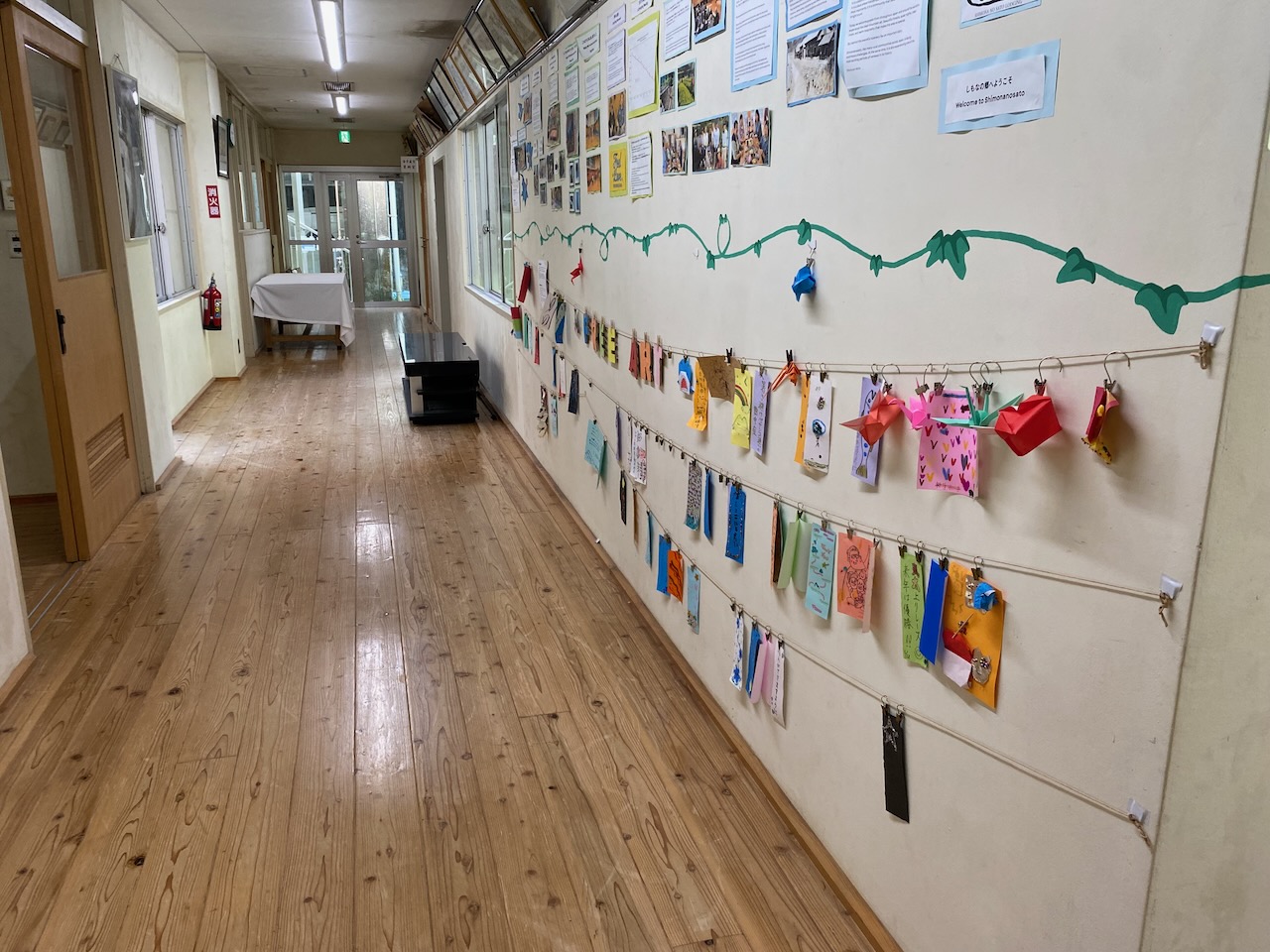 First-floor message wall and history display at Shimonanosato